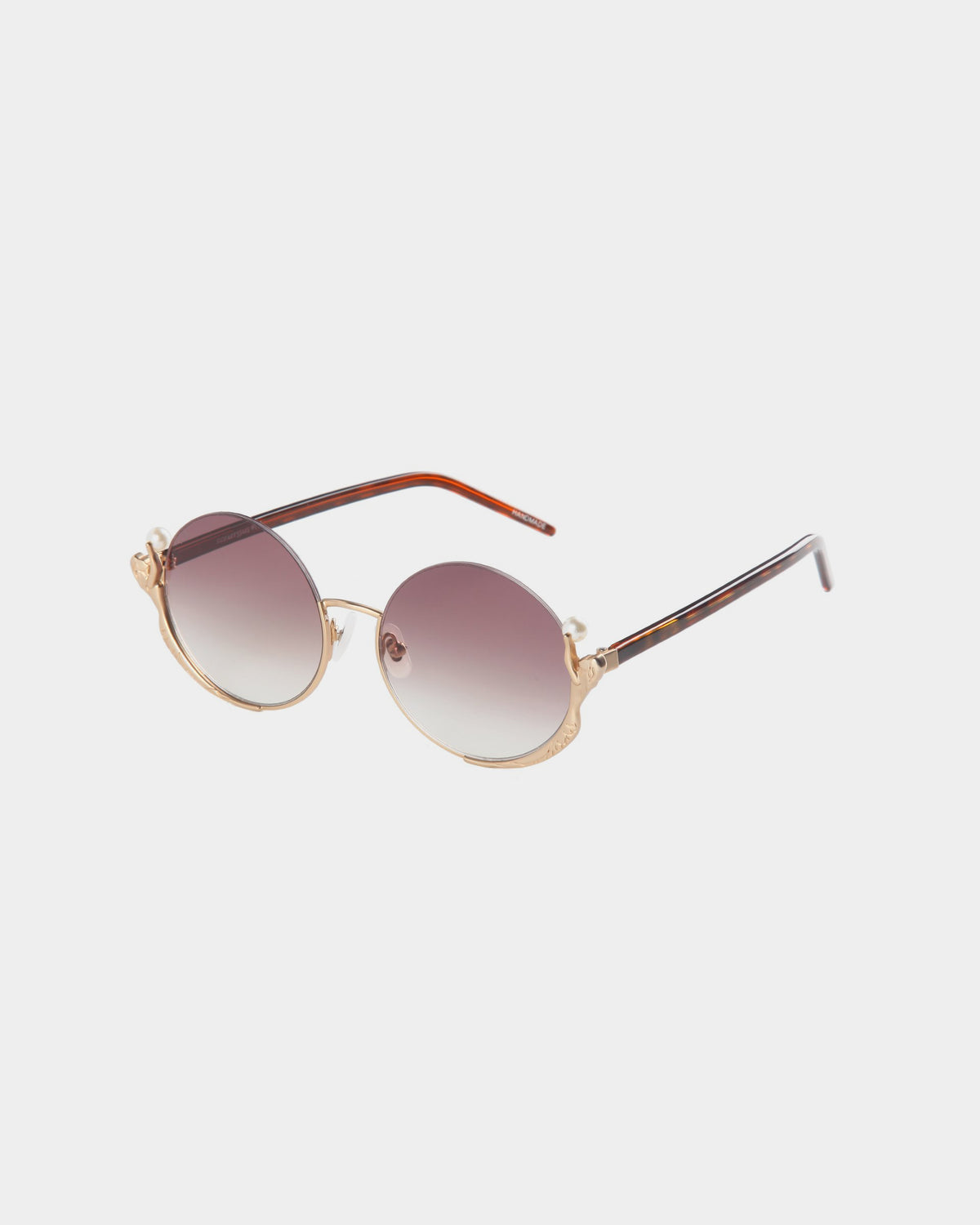 For Art's Sake® Ariel sunglasses feature round gold metal frames, brown gradient lenses, and brown-tipped arms for a stylish look, shown on a white background.