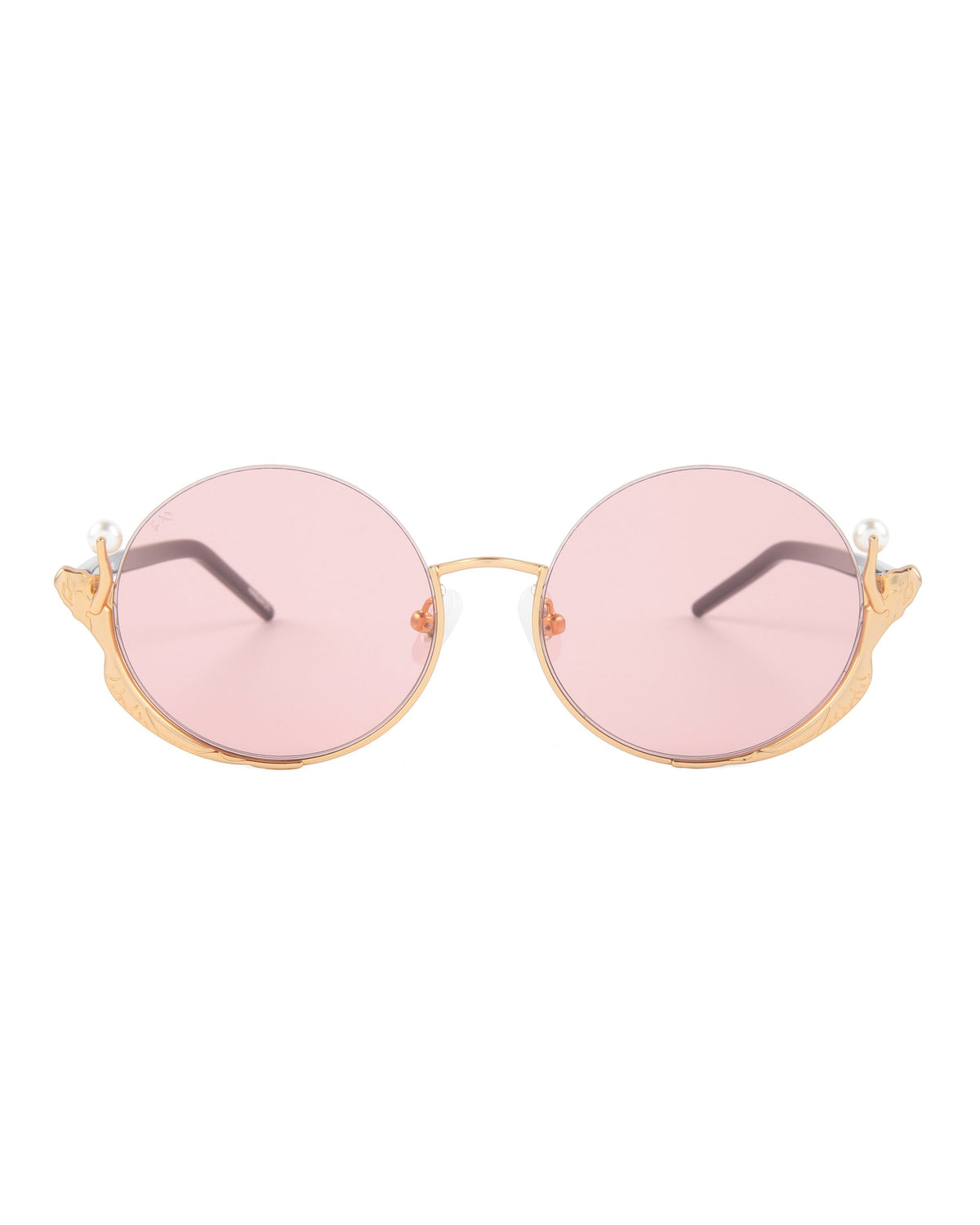 The Ariel sunglasses by For Art's Sake® feature round gold frames, pink lenses, wing details, and pearl accents for a mermaid-inspired, fashionable touch to any outfit.