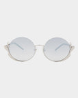 Ariel sunglasses by For Art's Sake® feature round silver frames, light blue gradient lenses, decorative side details, and slim straight arms. Displayed on a white background.