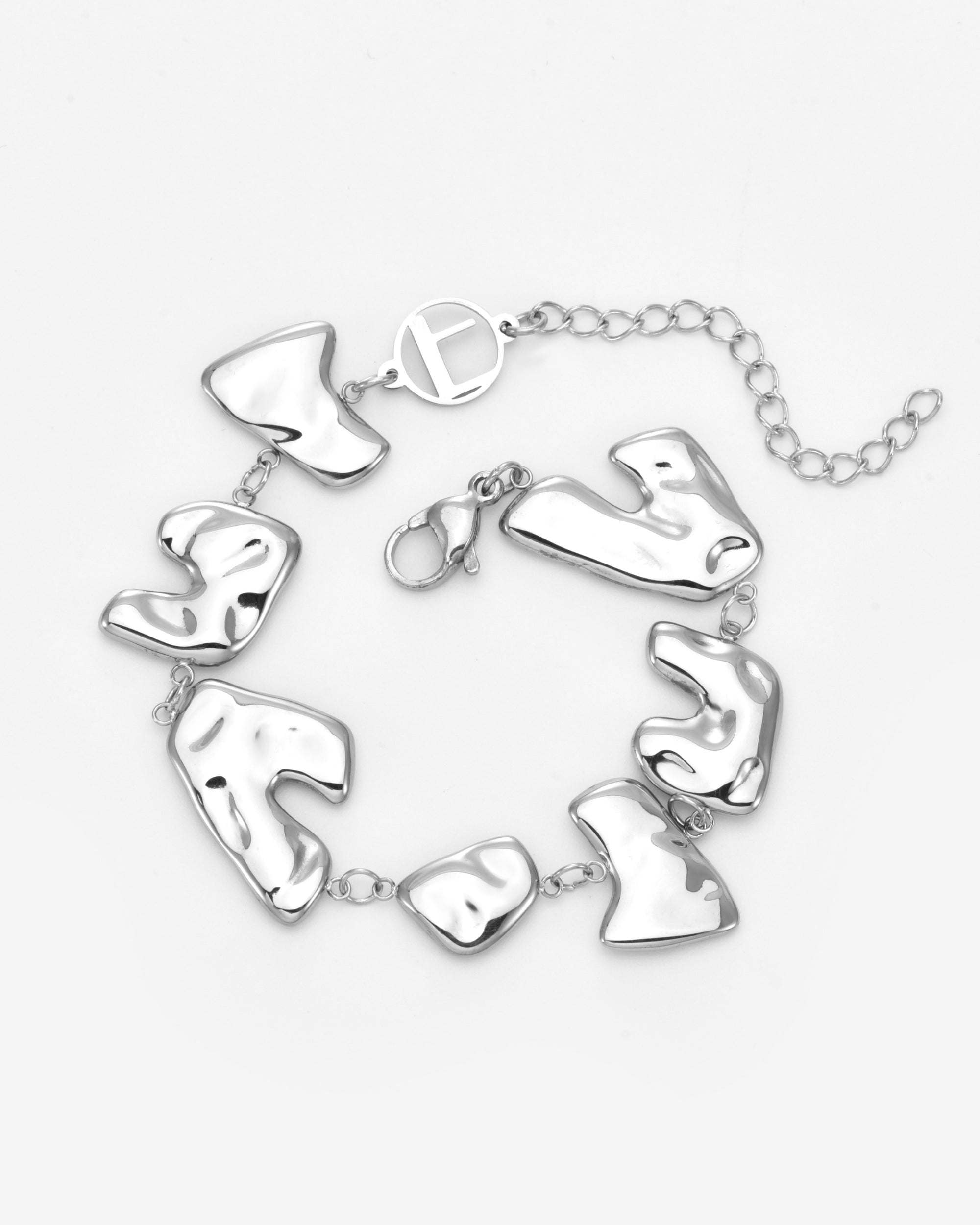 The Forms Bracelet by For Art's Sake® features abstract organic silver links, joined with small rings and finished with a lobster clasp plus an adjustable chain—ideal for layering. Shown against a white background.