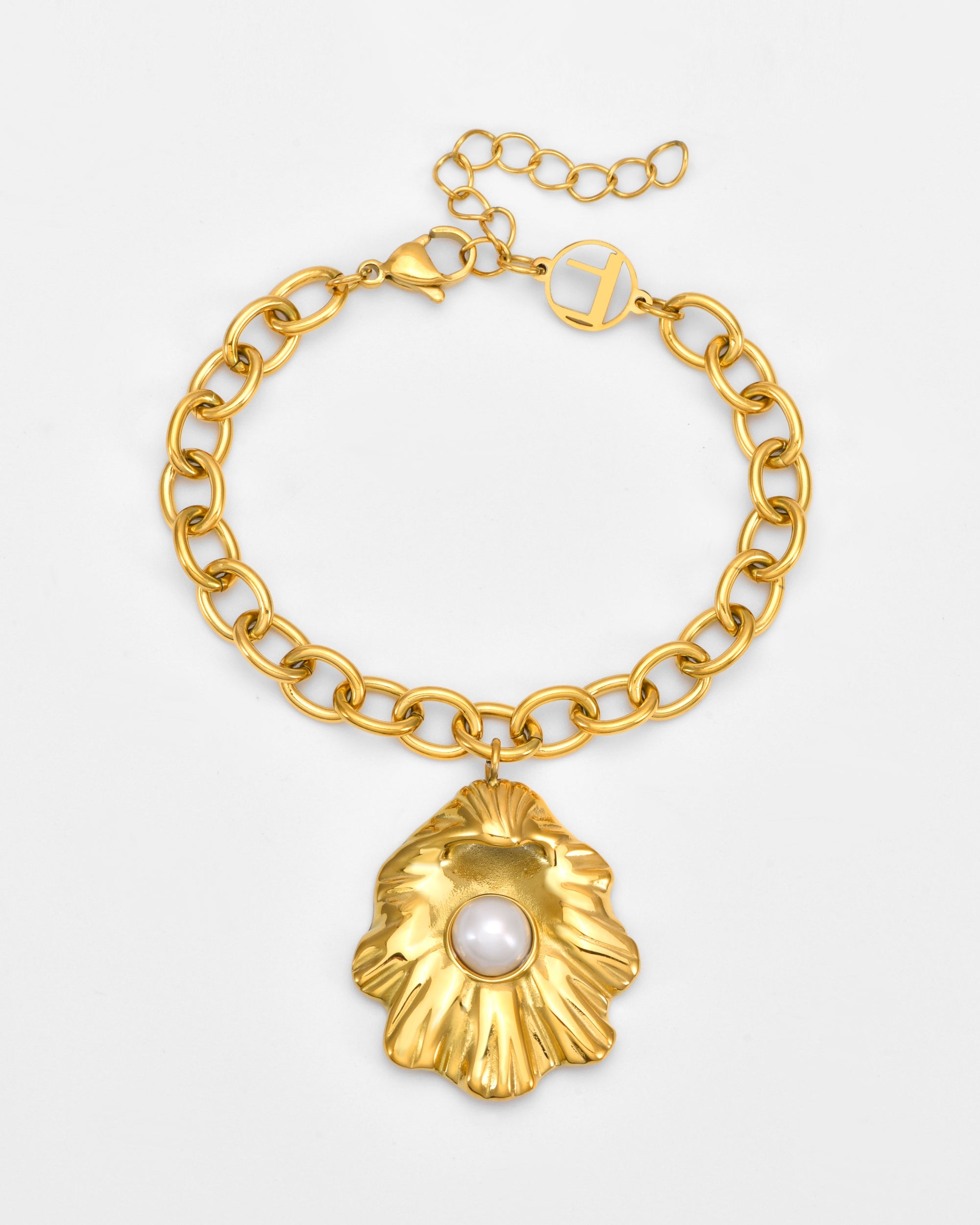 The Shell Pendant Bracelet by For Art's Sake® features a gold chain, a large textured gold leaf pendant with a central white pearl, plus a lobster clasp and adjustable extension chain.