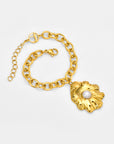 For Art's Sake® The Shell Pendant Bracelet features a gold chain with a large, textured leaf-shaped pendant centered by a white pearl. An adjustable extender and lobster clasp offer a custom fit, displayed on a plain light background.