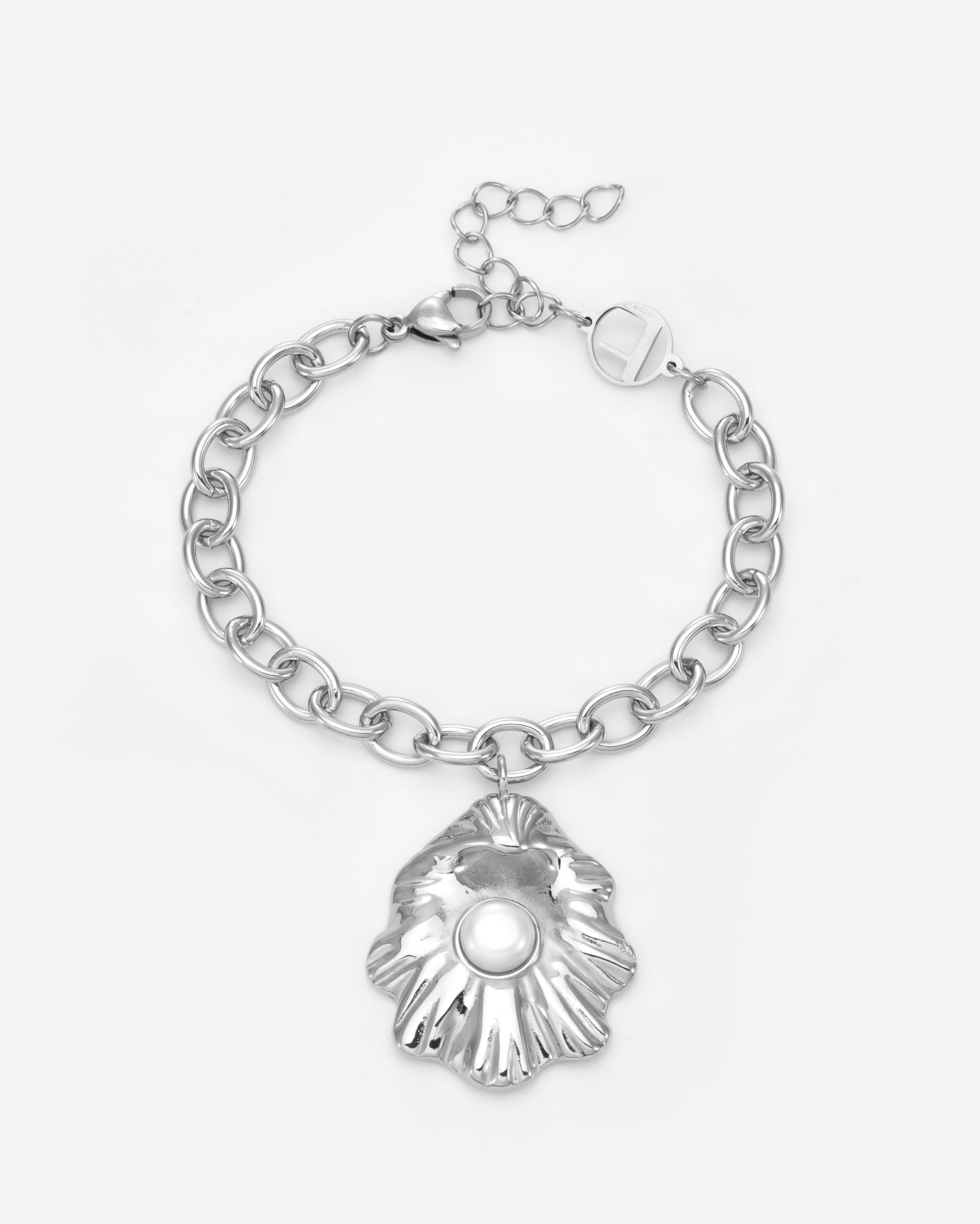 The Shell Pendant Bracelet by For Art's Sake® features a silver seashell-shaped charm with a freshwater pearl at its center, presented on a white background—an elegant touch of coastal jewellery.