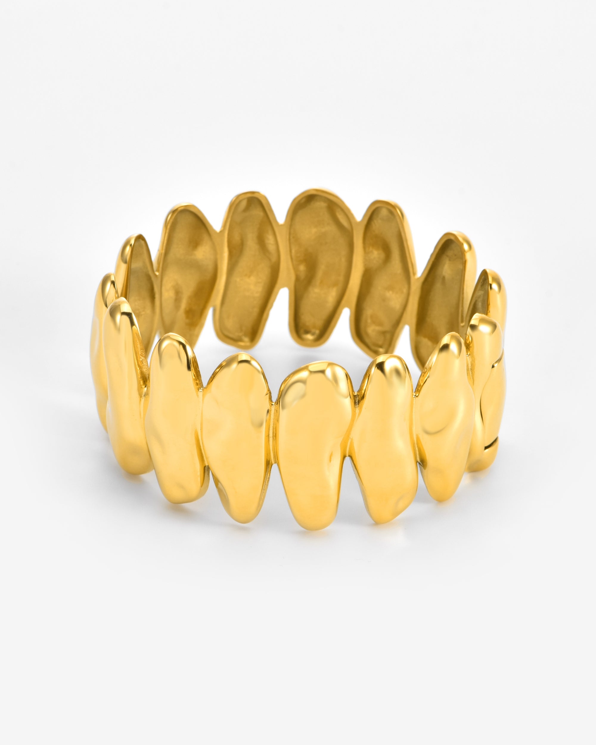 The Forms Bangle by For Art's Sake® showcases interlocking, irregular gold links with a polished finish, elegantly arranged in a circular band and set against a white background.