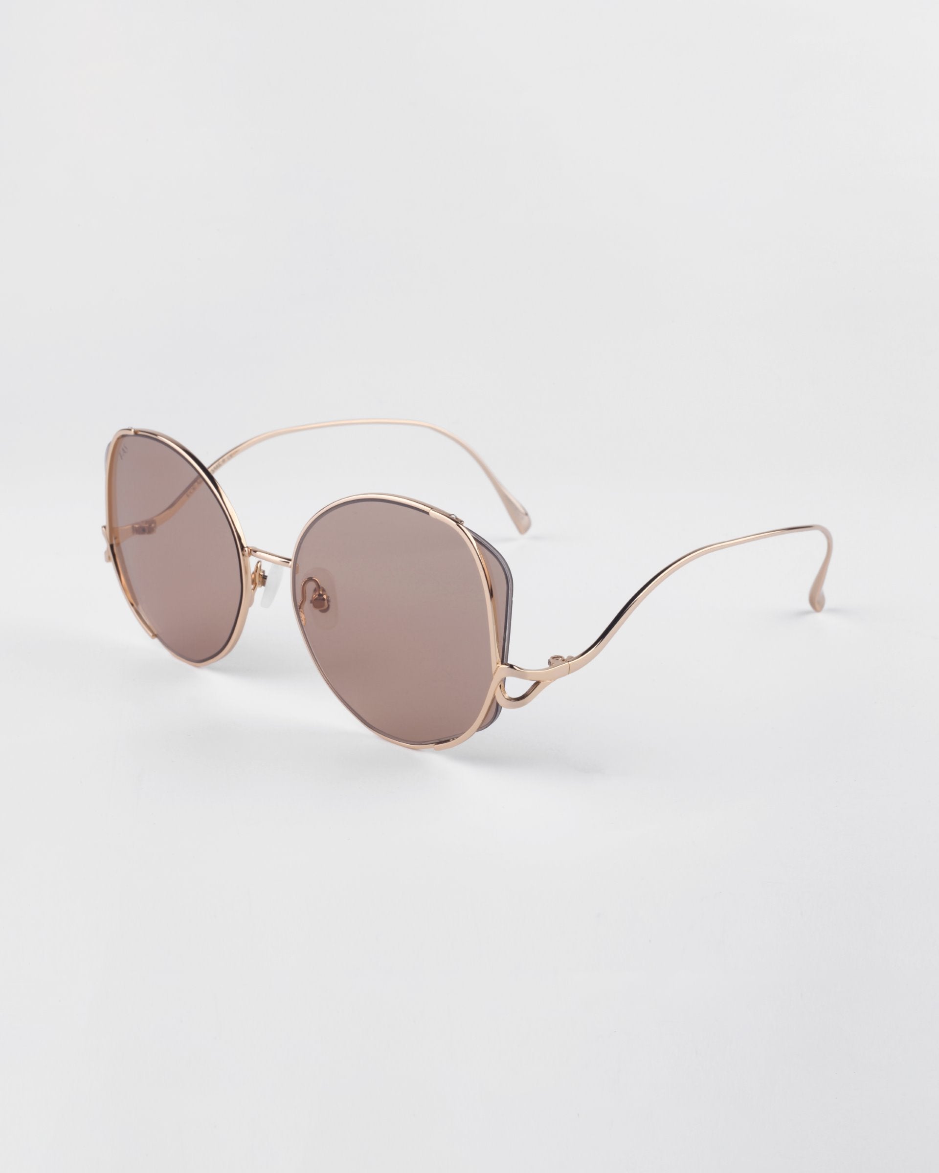 For Art's Sake 'Canvas' sunglasses in sand. A side view image showing the gold frame details with circle shapes. 