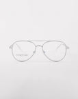 A pair of Cleo optical glasses by For Art's Sake® featuring silver frames with a thin metal bridge and clear prescription lenses is displayed against a plain white background. The brand "For Art's Sake" is subtly visible on one of the lenses. The overall design is sleek and minimalist, often available at discounted prices.