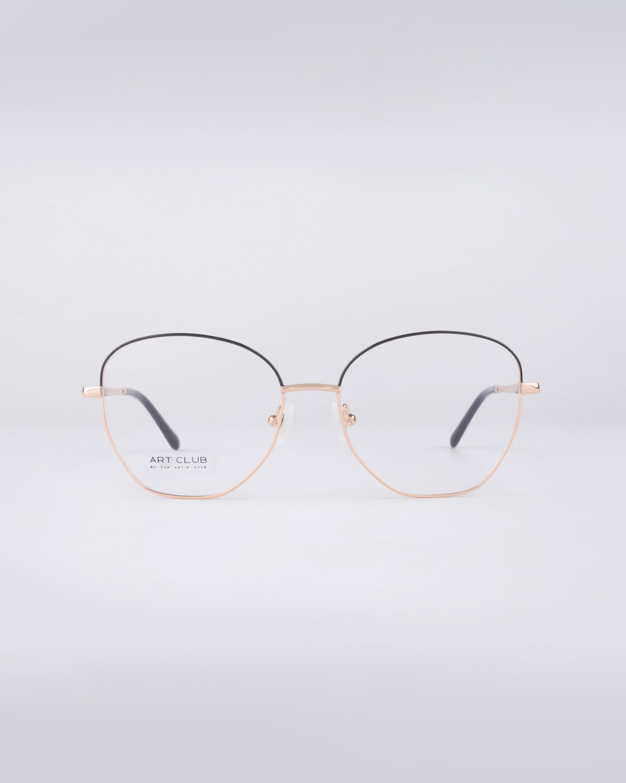Gold-rimmed, round blue light filter glasses named "Coco" by For Art's Sake®, featuring thin stainless steel frames and clear lenses, displayed on a light gray background. The brand name appears on the left lens.