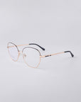 For Art's Sake® Coco gold metal eyeglasses feature round blue light filter lenses and slim black temple tips, elegantly displayed on a light grey background.