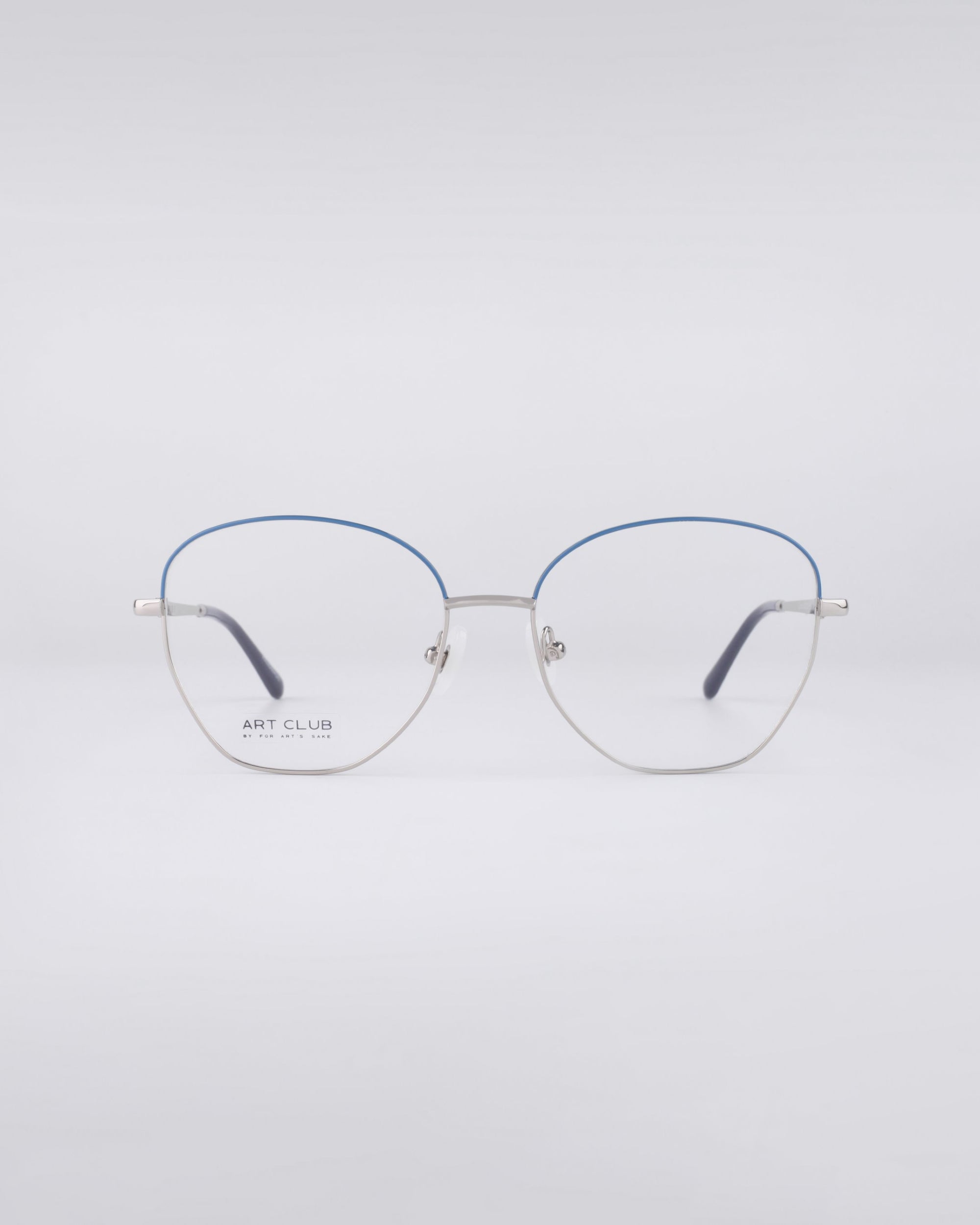 For Art's Sake® Coco: Minimalist blue light filter glasses with thin stainless steel frames, a subtle blue accent on the top rim, and comfortable jade nose pads, shown against a plain light gray background.