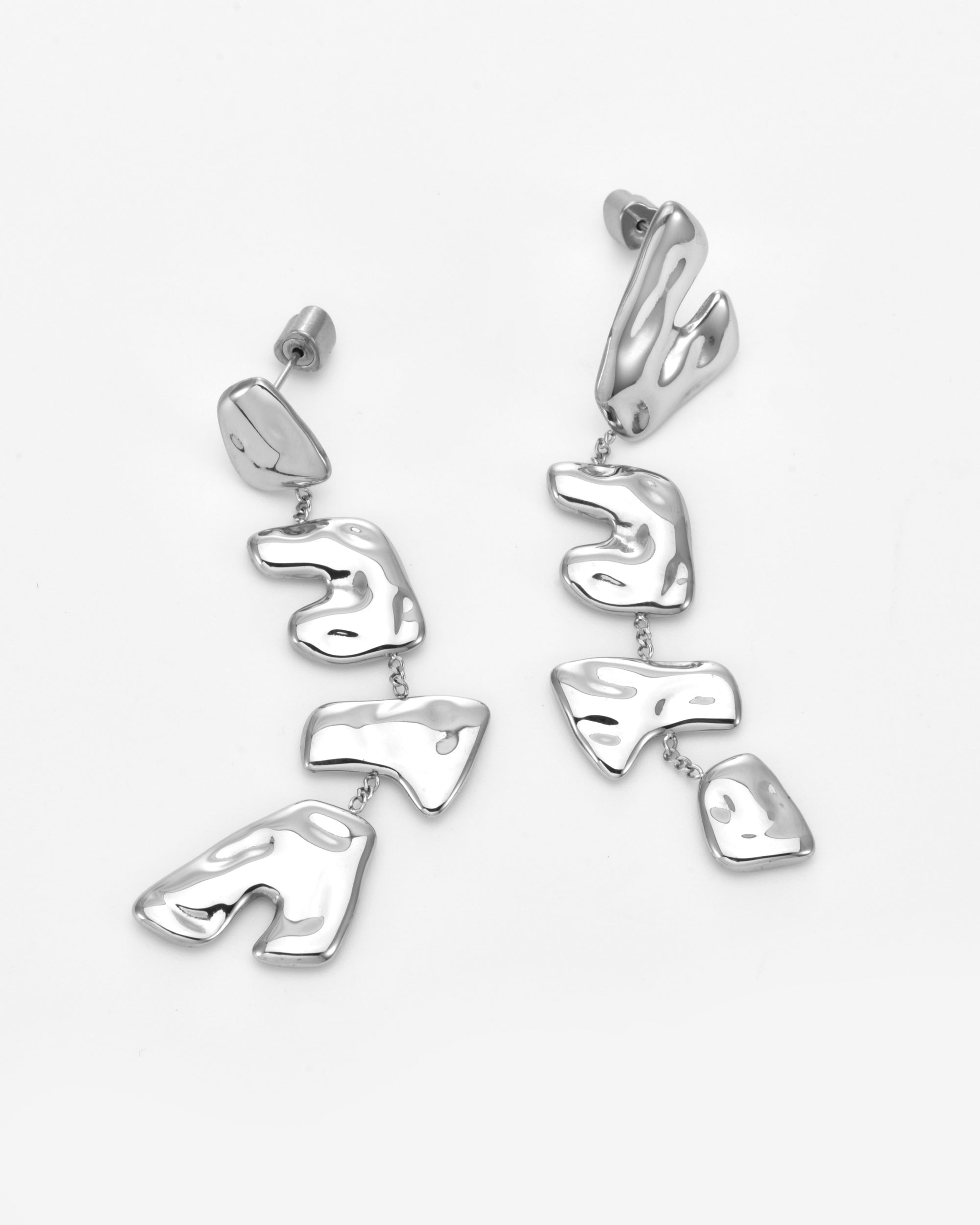 The Forms Earrings by For Art's Sake® are dangling silver earrings featuring abstract, irregular vertical segments that highlight the beauty of organic metal design, shown against a plain white background.