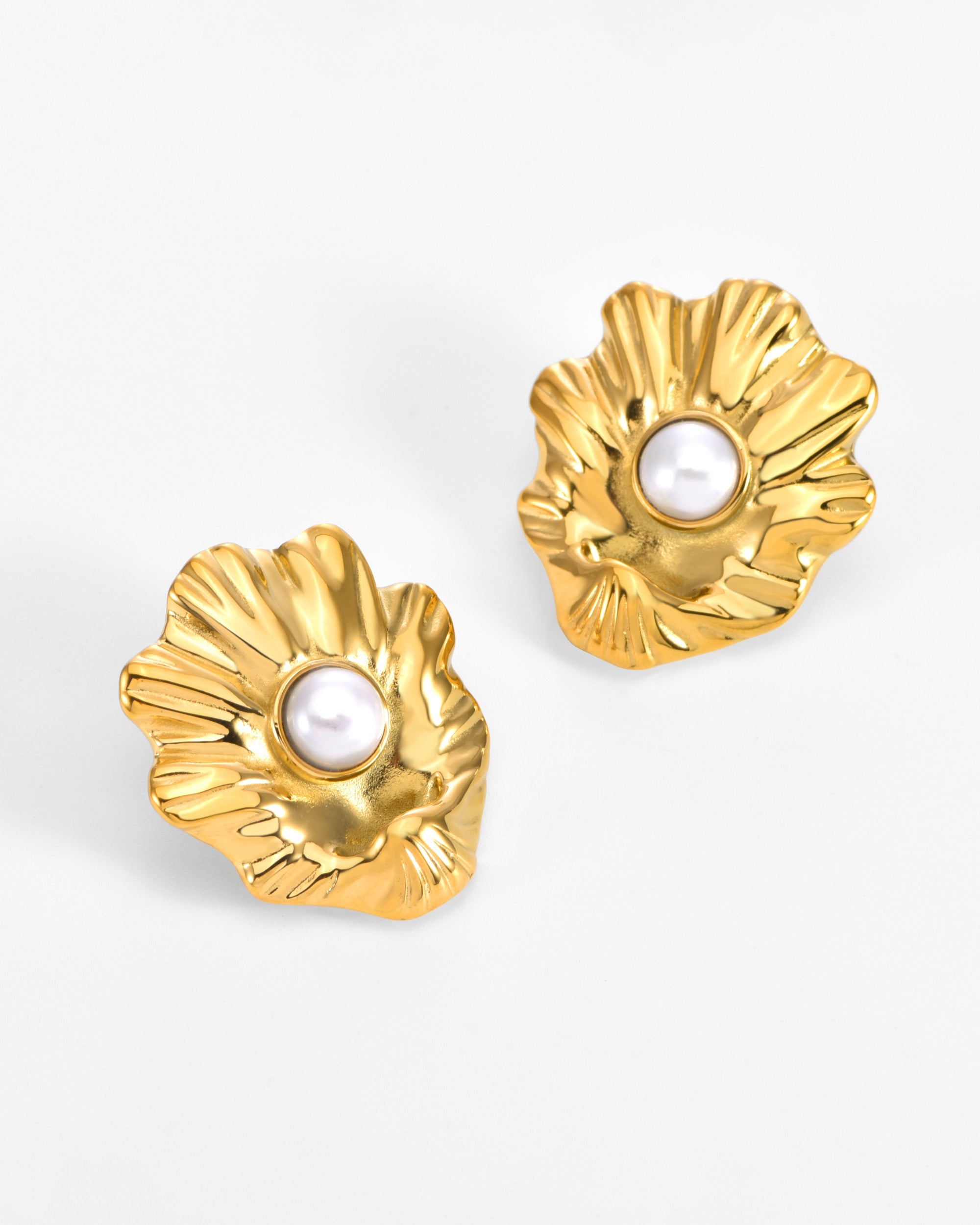 For Art's Sake® The Shell Earrings: Gold, flower-shaped sea shell earrings with a ruffled texture and a central round freshwater pearl—perfect for everyday wear and displayed on a plain white background.