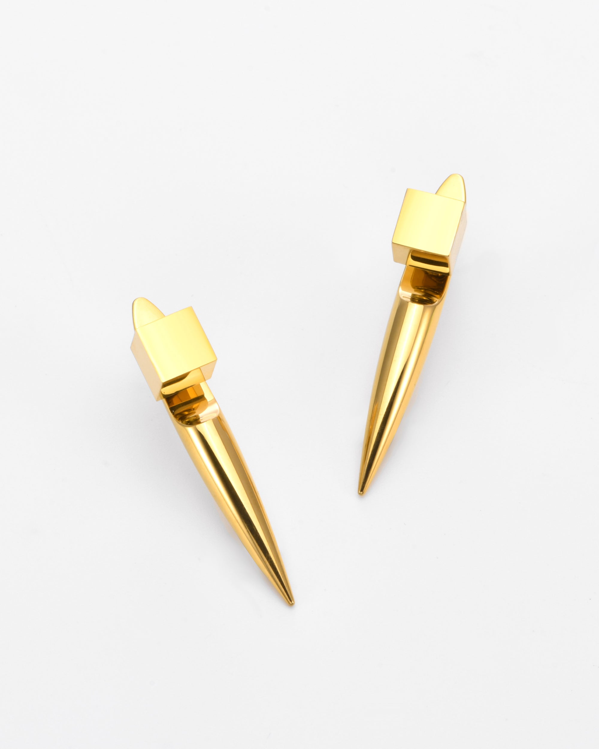 The Droplets Earrings by For Art's Sake® are modern statement earrings with cube-shaped tops and elongated, pointed drops, crafted as lightweight jewellery and shown on a plain white background.