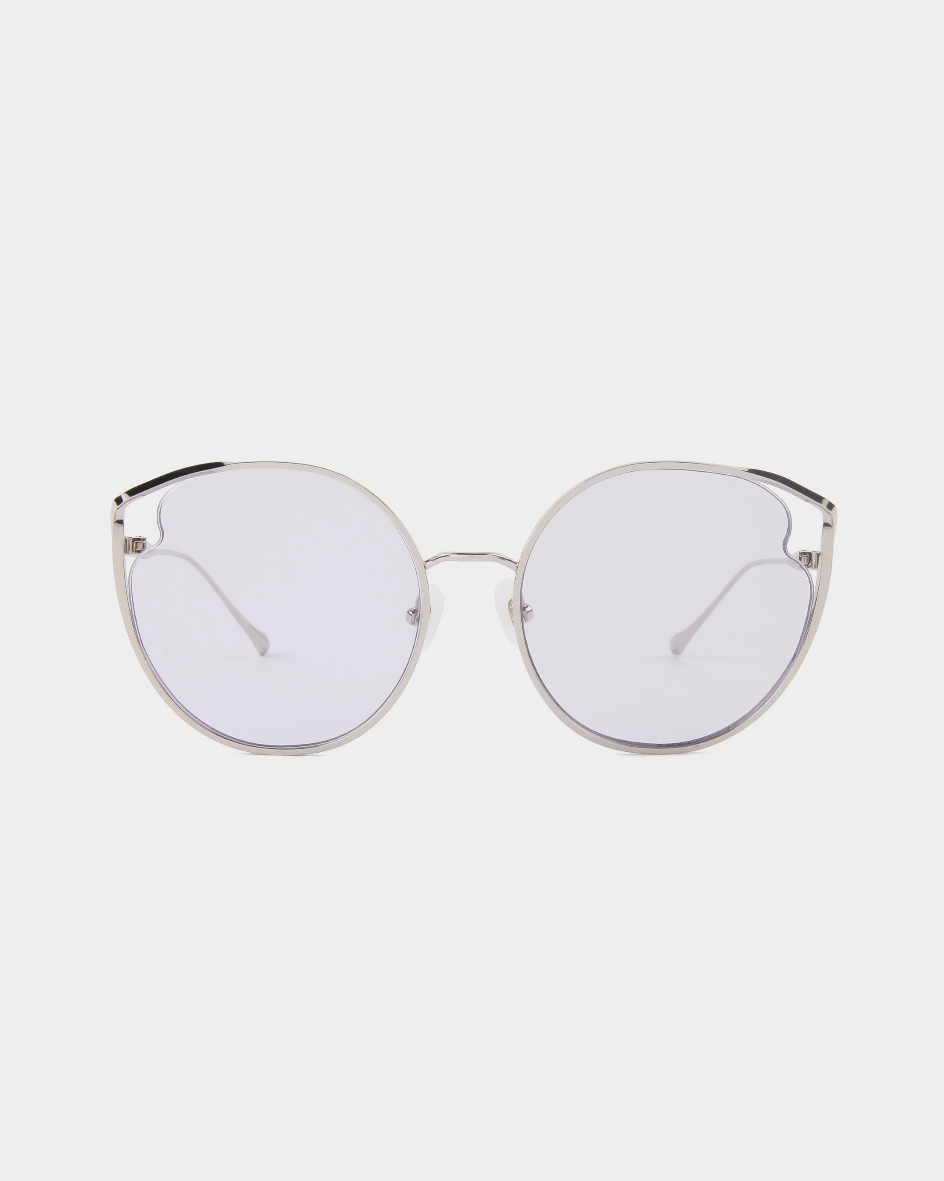 A pair of round, silver-framed eyeglasses with clear nylon lenses against a plain white background. The glasses have thin metal temples and a minimalist design, offering UVA & UVB protection. The product name is Cat by For Art's Sake®.