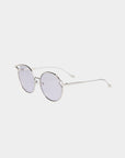 Round sunglasses with thin, silver metal frames and lightly tinted, nylon lenses are displayed against a plain white background. The design features slightly raised corners above the lenses for a subtle cat-eye effect. Each pair of Cat by For Art's Sake® provides UVA & UVB protection for your eyes.