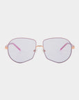The Explorer by For Art's Sake® is a pair of eyeglasses featuring thin, rose gold frames and light pink UV-protected nylon lenses. These glasses showcase a geometric shape with subtly rounded edges. The bridge and nose pads are also crafted in rose gold, while the temples come with matching pink tips.