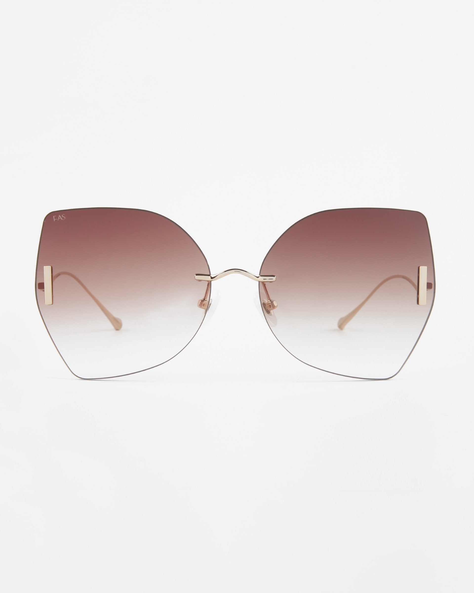 Introducing the Starlight sunglasses from For Art's Sake®: a pair of large, square-shaped eyewear featuring elegant thin gold frames and shatter-resistant nylon lenses. These gradient brown-tinted lenses transition beautifully from darker at the top to lighter at the bottom, and offer full UV protection, beautifully showcased against a plain white background.