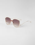 A pair of Spacie sunglasses from For Art's Sake® featuring handmade 18-karat gold plating on a white background.