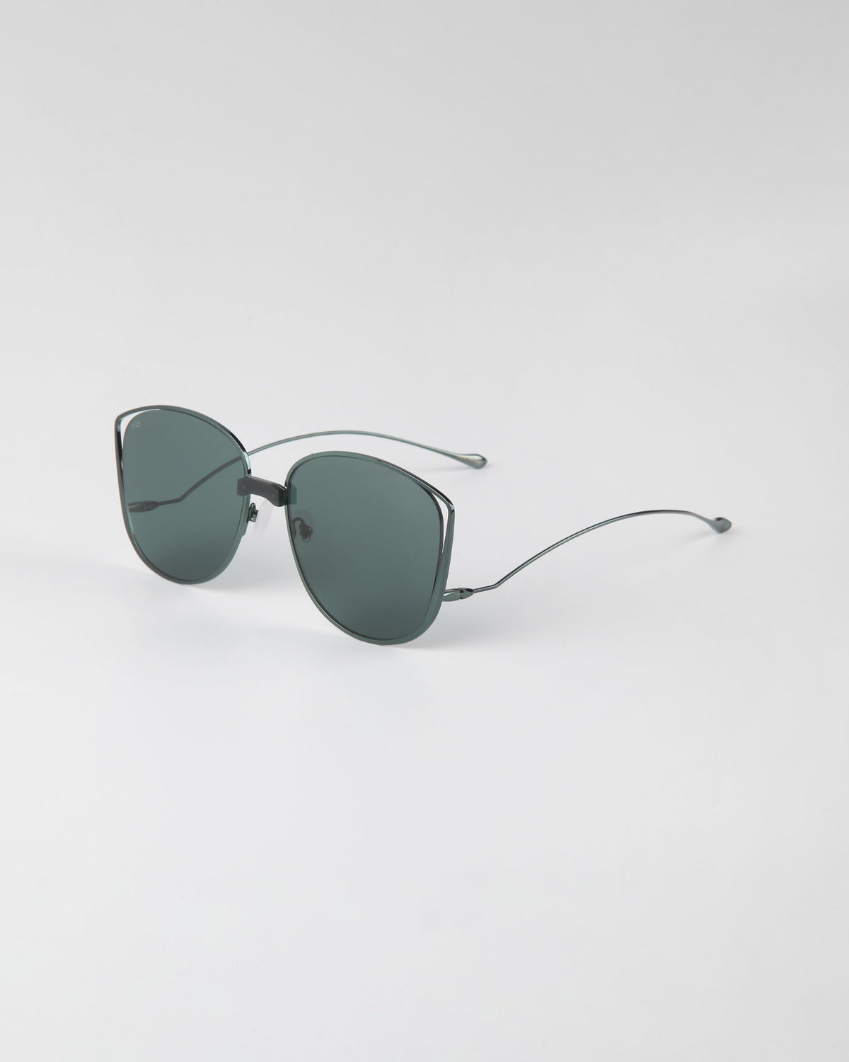 A pair of stylish Spacie sunglasses from For Art's Sake®, featuring dark-lensed, softly rounded square lenses, a sleek metallic frame with 18-karat gold plating, and thin curved arms, resting on a plain white surface. This elegant design also includes unique jadestone nosepads.