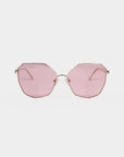 A pair of Moma sunglasses with large, geometric-shaped lenses in a light pink hue. The frame is thin and metallic with a golden finish, crafted from durable stainless steel. The minimalistic design offers a modern and stylish appearance. These For Art's Sake® shades also provide 100% UVA and UVB protection.