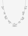 The Forms Necklace by For Art's Sake® features seven irregular, organic metal charms evenly spaced on a delicate silver chain, displayed against a plain white background.