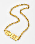 The Geometry Necklace by For Art's Sake® features large, rounded gold chain links and an oversized rectangular and oval clasp, shown on a plain white background.