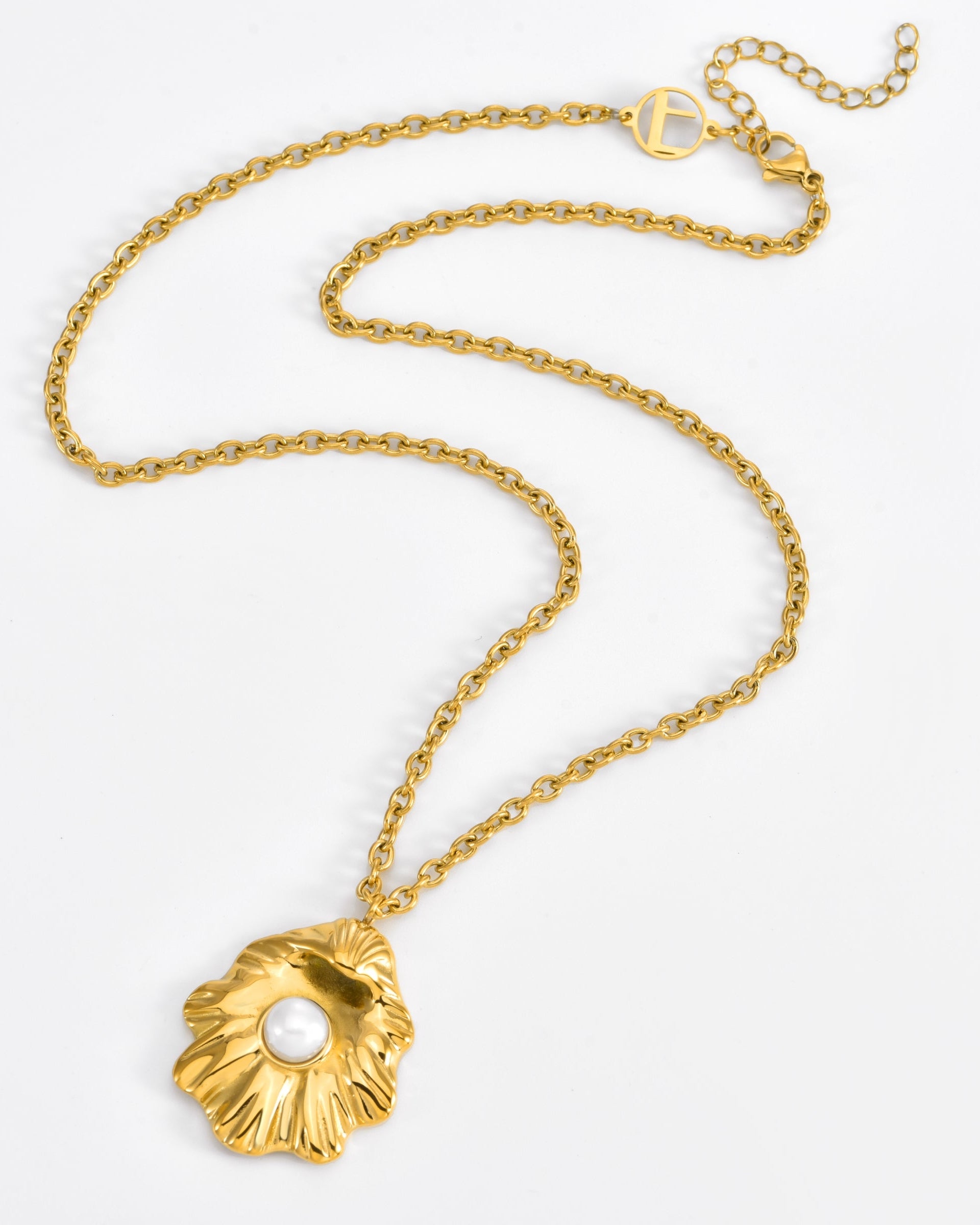 The Shell Pendant Bracelet by For Art's Sake® features a flower-shaped pendant with a central white pearl, presented on a clean white background.