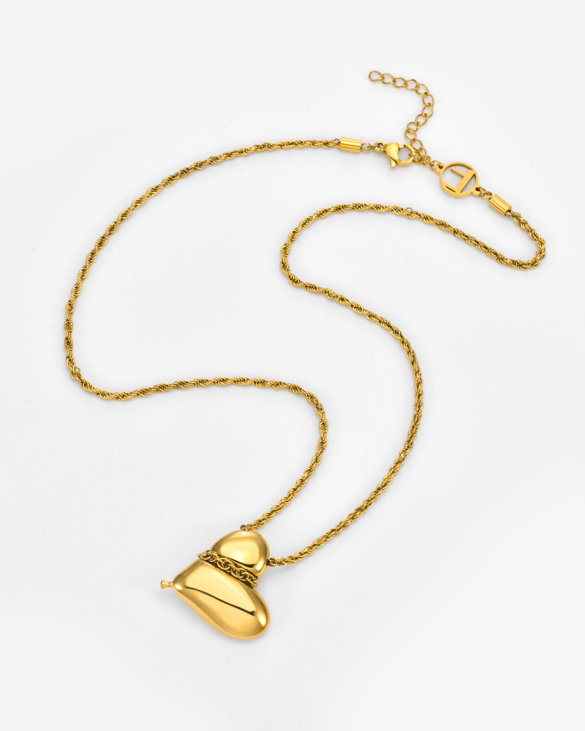 The Puffy Heart Bracelet by For Art's Sake® features a sculptural, abstract heart-shaped charm and an adjustable chain with a lobster clasp, shown on a white background.