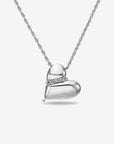 The Puffy Heart Pendant by For Art's Sake® is a silver chain necklace with a textured design and a shiny, puffed heart charm, shown on a plain white background.