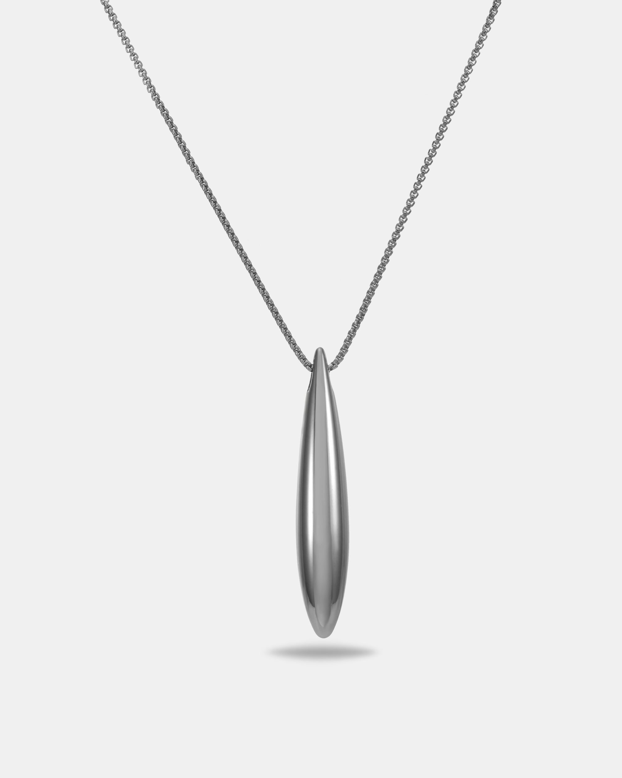 The Droplets Pendant Necklace by For Art's Sake® features a modern, delicate chain with an elongated, smooth metal droplet pendant, elegantly showcased on a plain white background.