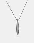 The Droplets Pendant Necklace by For Art's Sake® features a modern, delicate chain with an elongated, smooth metal droplet pendant, elegantly showcased on a plain white background.