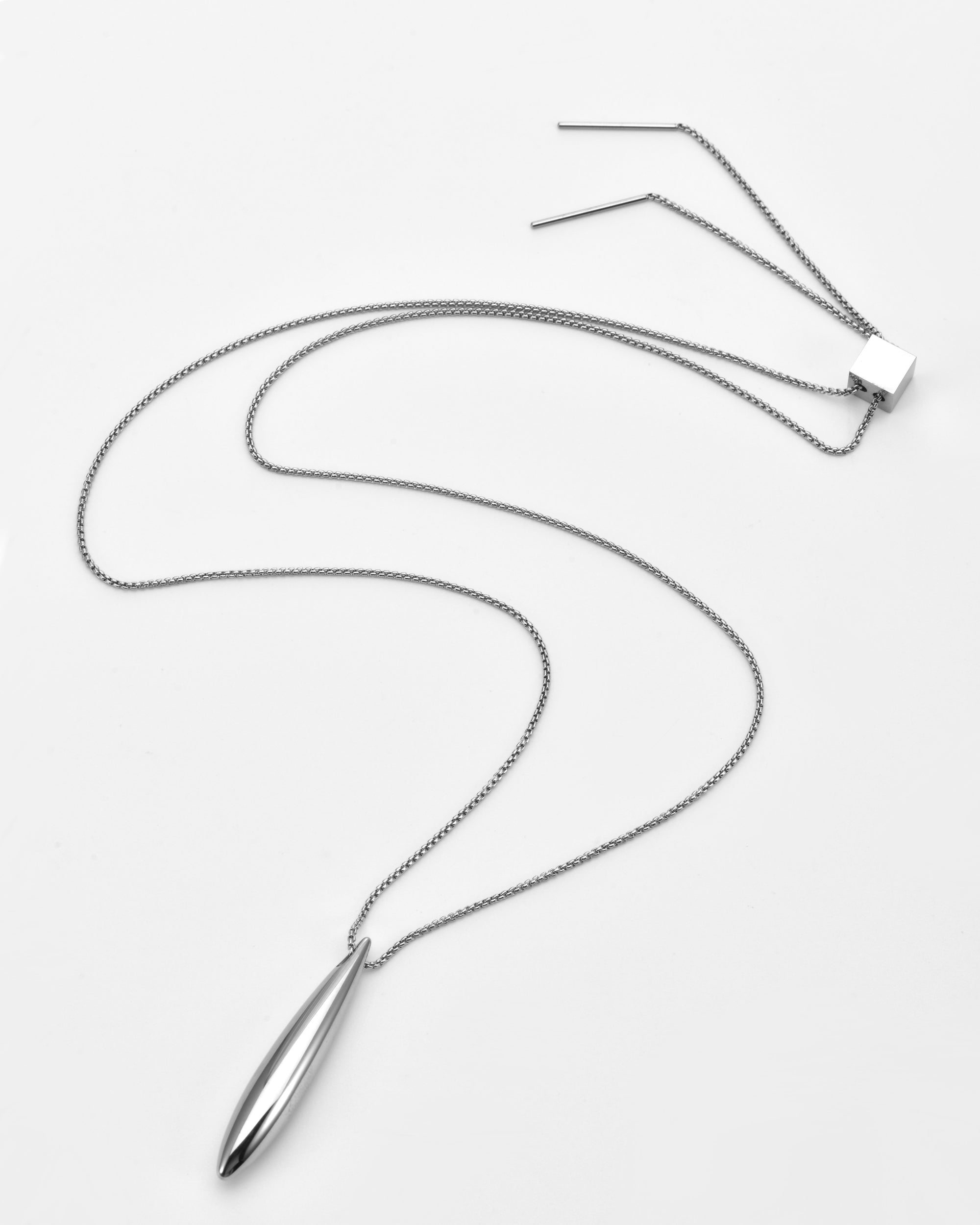 The Droplets Pendant Necklace by For Art's Sake® features a sleek, elongated metal droplet on a delicate chain with adjustable straight bar ends, shown elegantly against a white background.