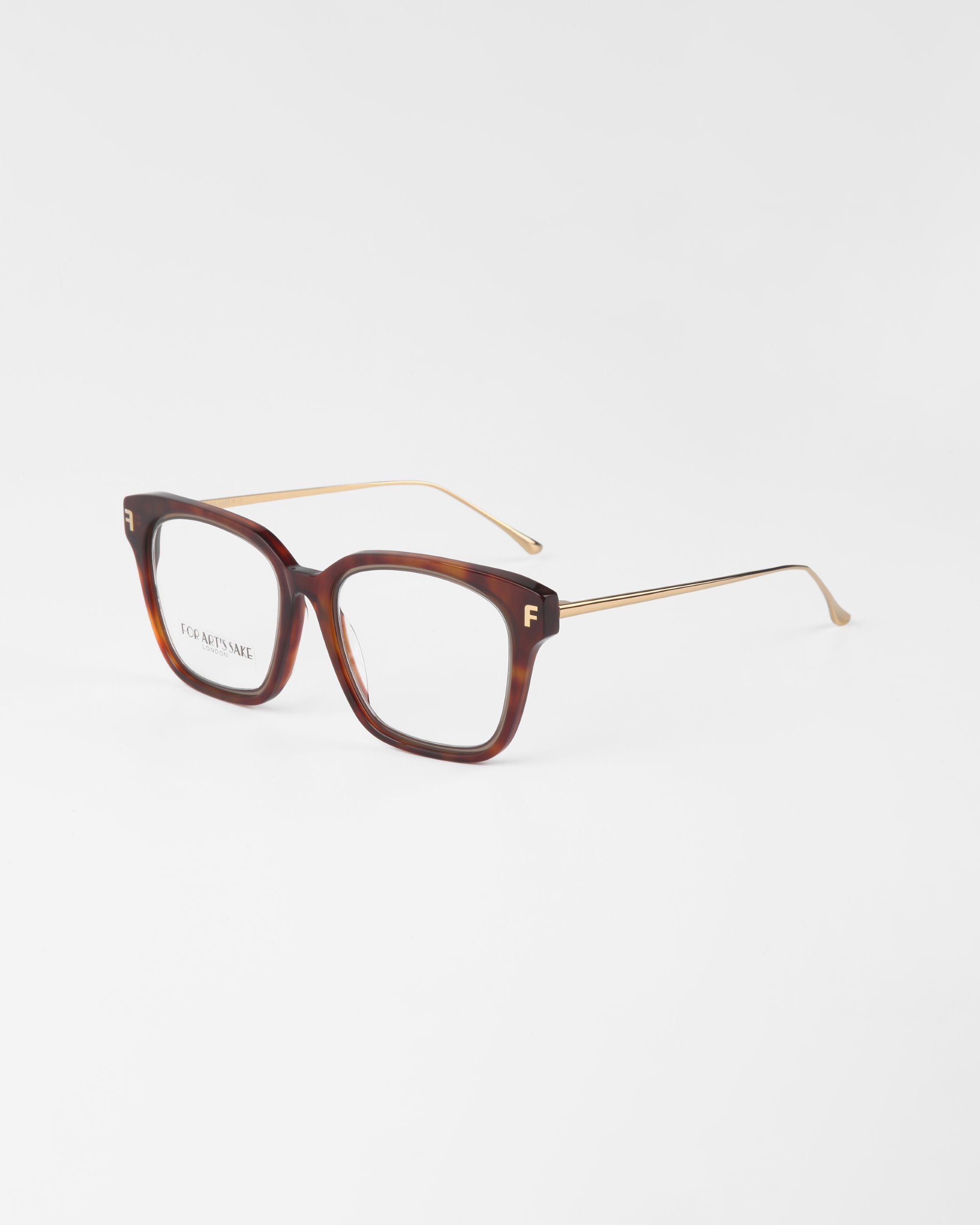 A pair of eyeglasses named Florence by For Art's Sake® featuring a plant-based acetate tortoiseshell-pattern frame with gold metal temples. The rectangular lenses offer UV protection, with "F.C.C. ARTWEAR" displayed on the inner side of the left lens, set against a plain white background.