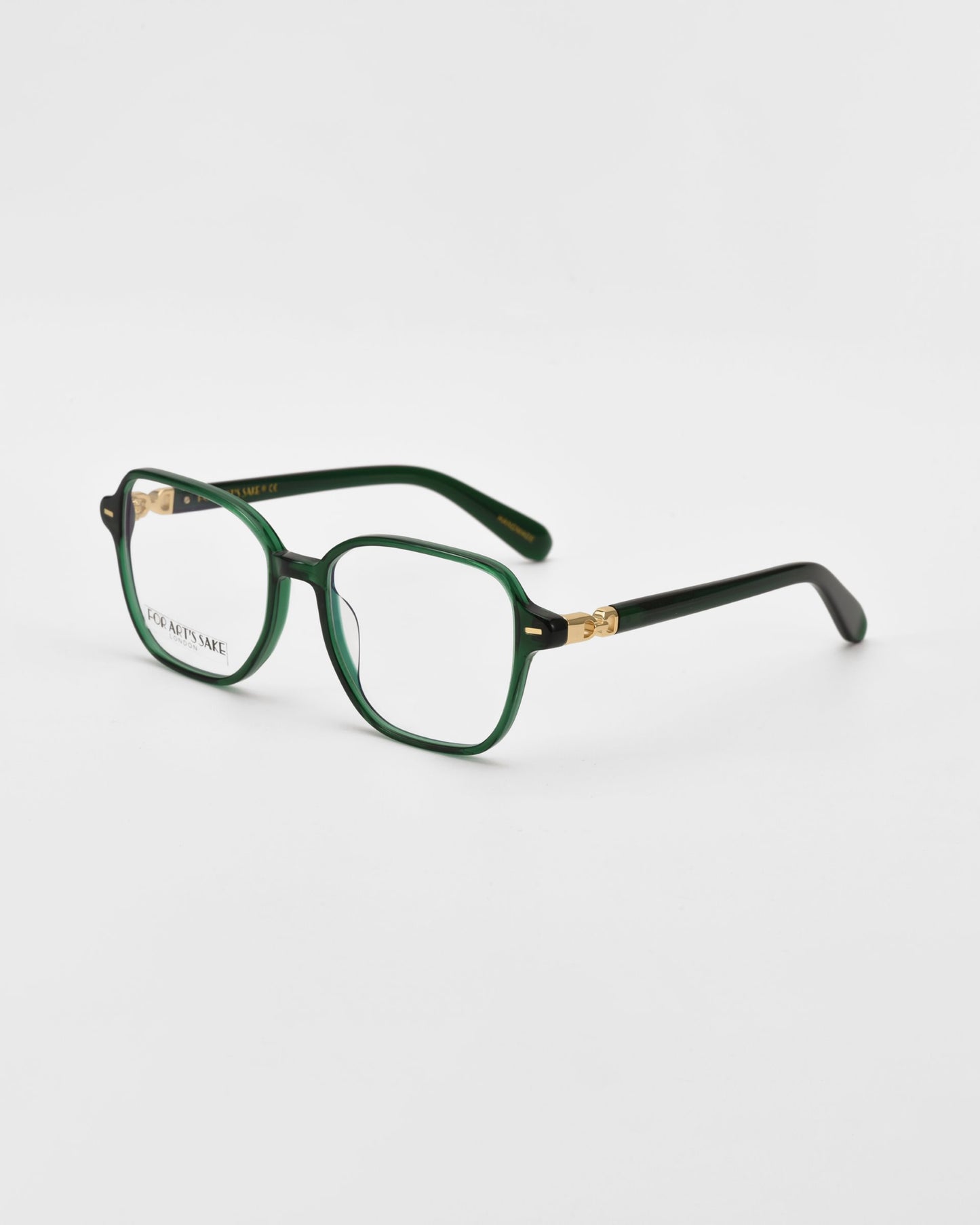 Green cat-eye shaped optical glasses on a white background facing sideways accentuating the gold temples.