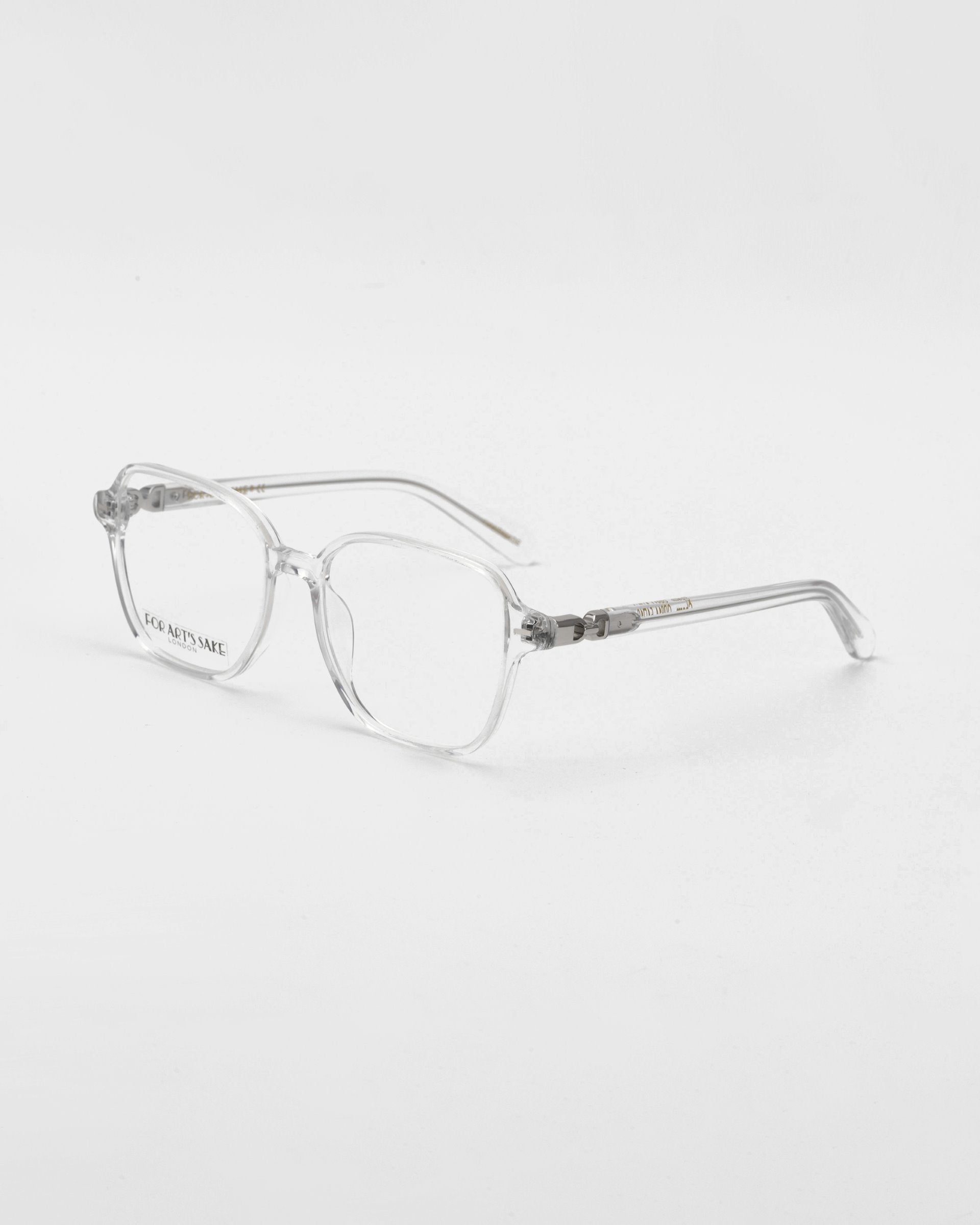 A pair of For Art's Sake® Charm transparent framed optical glasses in a cat-eye shape against a white background.