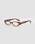 For Art's Sake® Cigar: Thick vintage tortoiseshell oval optical frames with gold “D” detail on the temples, shown on a light gray background.
