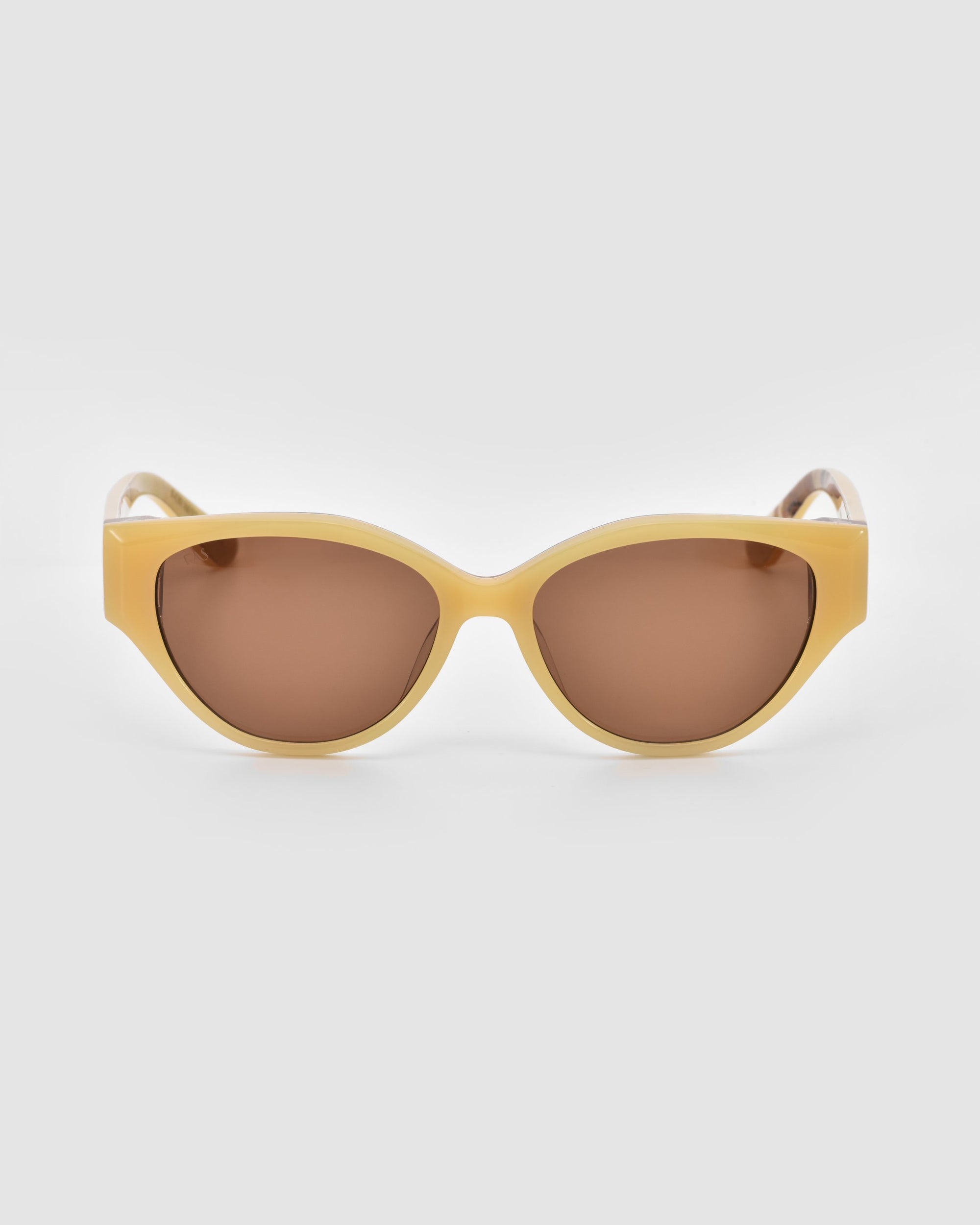 The Vincent Van Gogh by For Art's Sake® features collectible eyewear with thick light yellow frames and brown tinted lenses, shown against a plain light gray background.