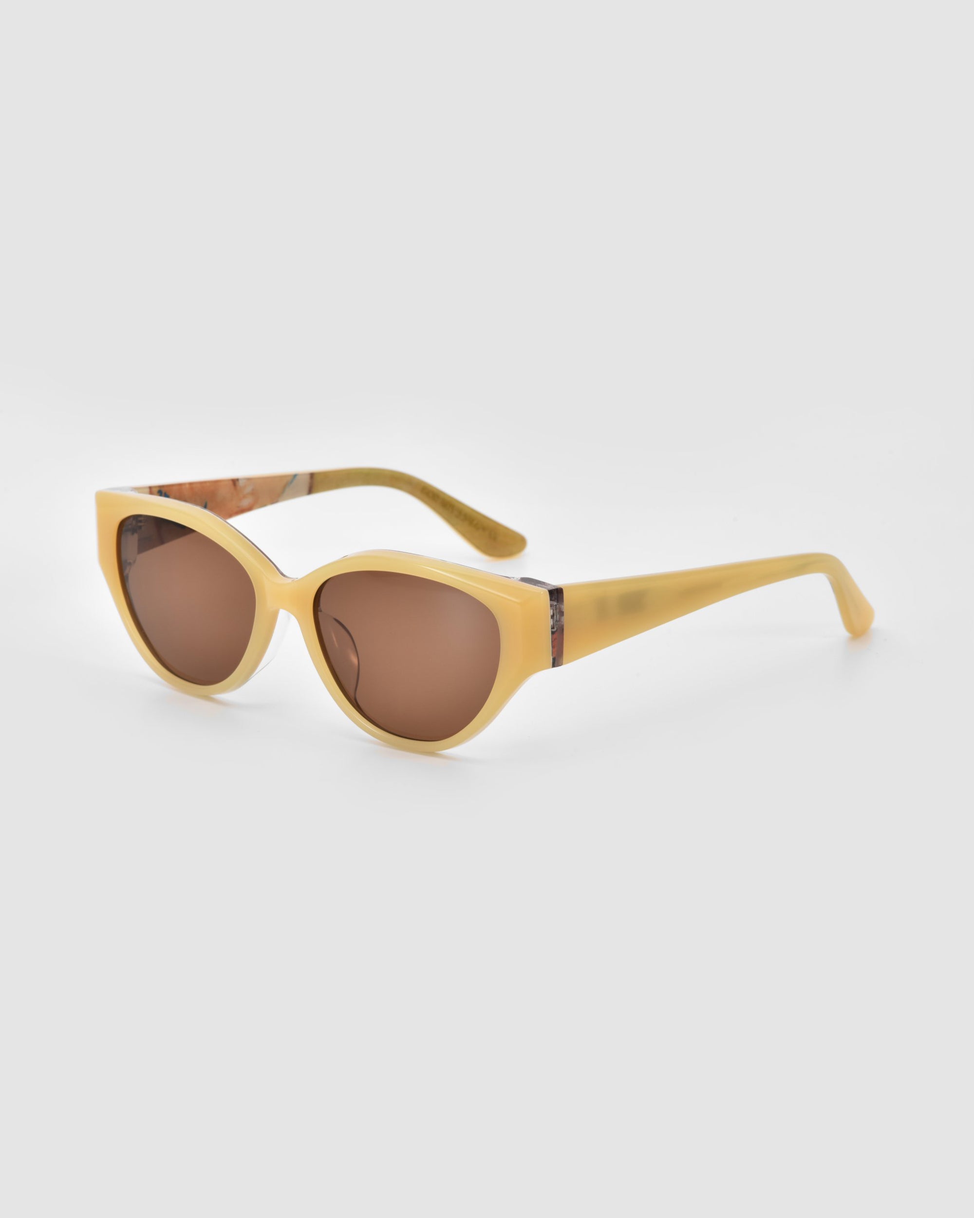 The For Art's Sake® Vincent Van Gogh sunglasses feature yellow, slightly thick frames, round brown lenses, and subtly marbled temples, displayed against a plain light gray background.