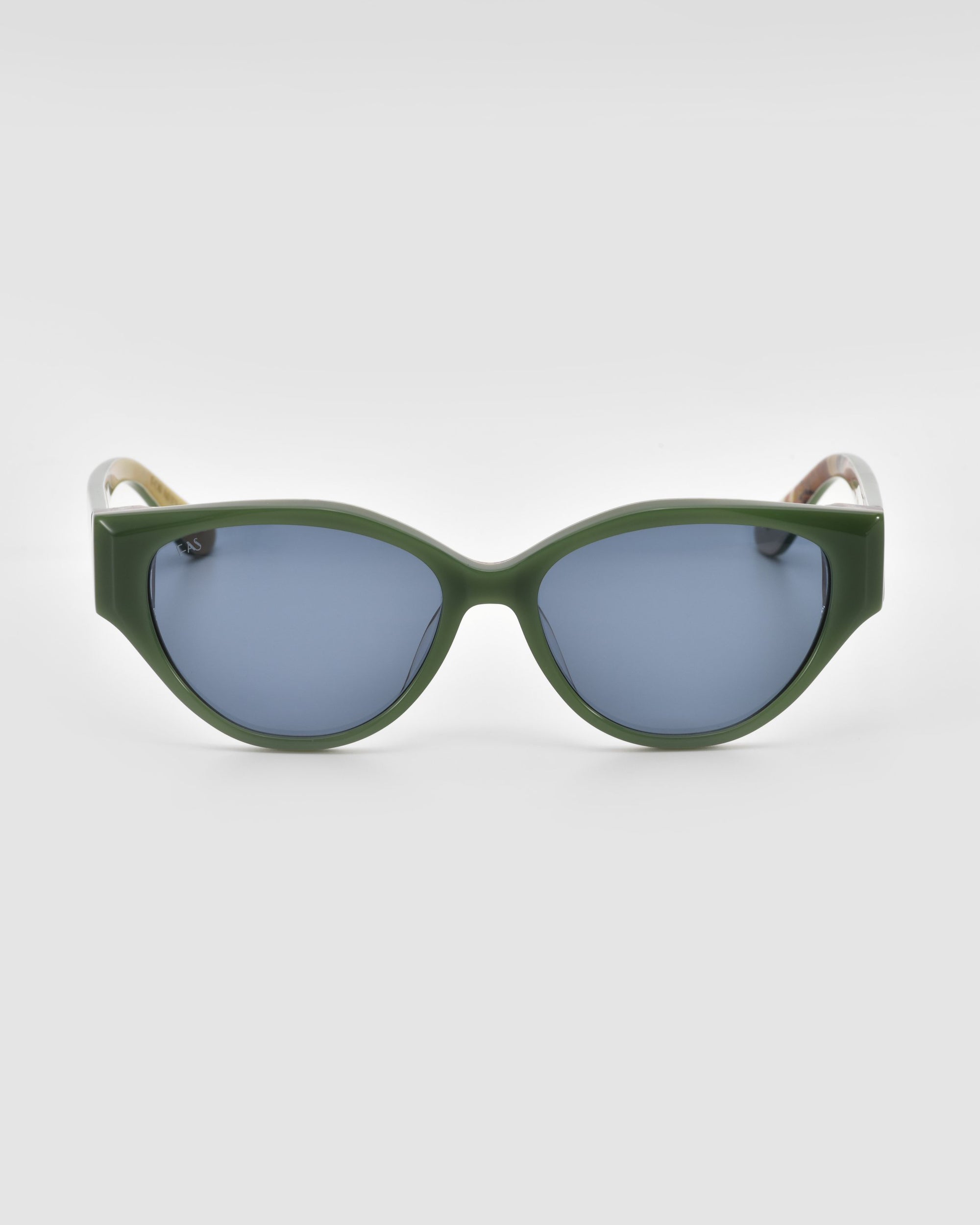 Front view of For Art's Sake® Vincent Van Gogh collectible eyewear, featuring thick dark green frames and blue-tinted oval lenses against a plain white background.