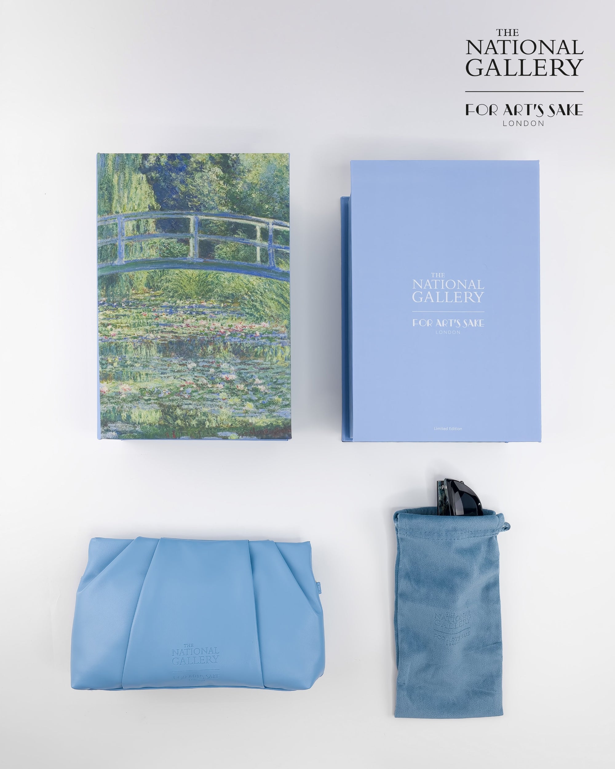A flat lay shows For Art&#39;s Sake® Claude Monet (Limited Edition) sunglasses, a Monet-themed book, a blue box, and light blue pouch on a white background. The National Gallery London logo appears in the top right corner.