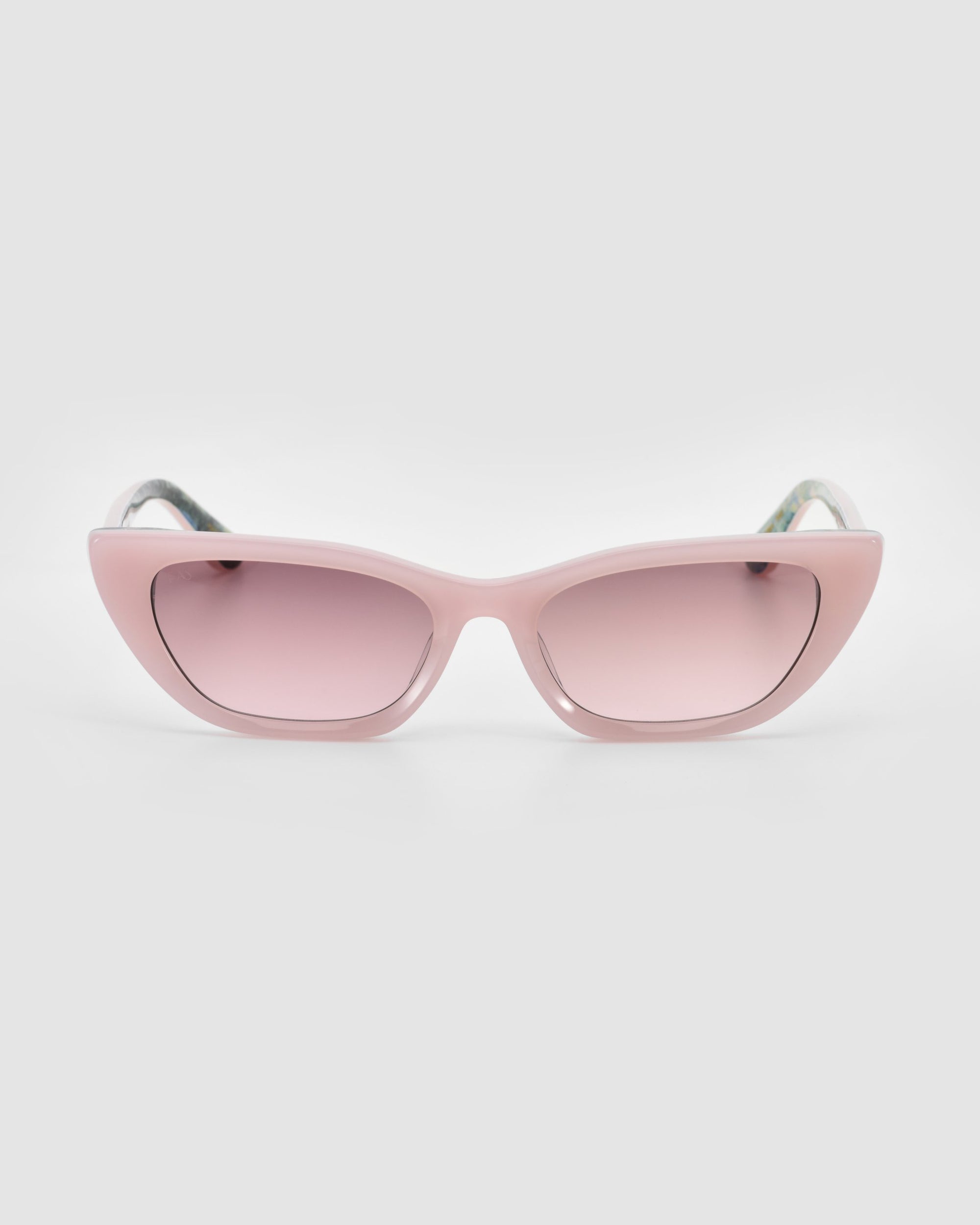 The For Art's Sake® Claude Monet limited edition cat-eye sunglasses feature pink frames and matching pink tinted lenses, shown against a plain light gray background.