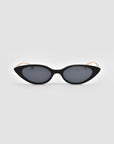 The For Art's Sake® Slash sunglasses feature black sculptural cat-eye frames with dark lenses and beige arms, shown against a plain light gray background.