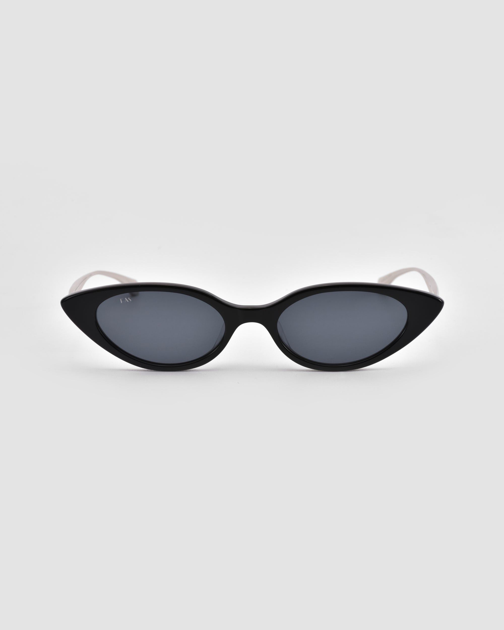 The For Art's Sake® Slash sunglasses feature black cat-eye frames and dark lenses, showcased against a plain light gray background.