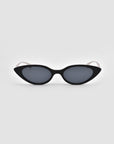 The For Art's Sake® Slash sunglasses feature black cat-eye frames and dark lenses, showcased against a plain light gray background.
