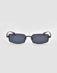 The Lucio sunglasses by For Art's Sake® feature a rectangular black frame with dark tinted lenses and a sculpted design, displayed face-on against a plain light gray background.