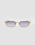 For Art's Sake® Lucio sunglasses feature a sculpted rectangular gold metal frame and gradient lenses fading from blue to clear, shown on a light gray background.