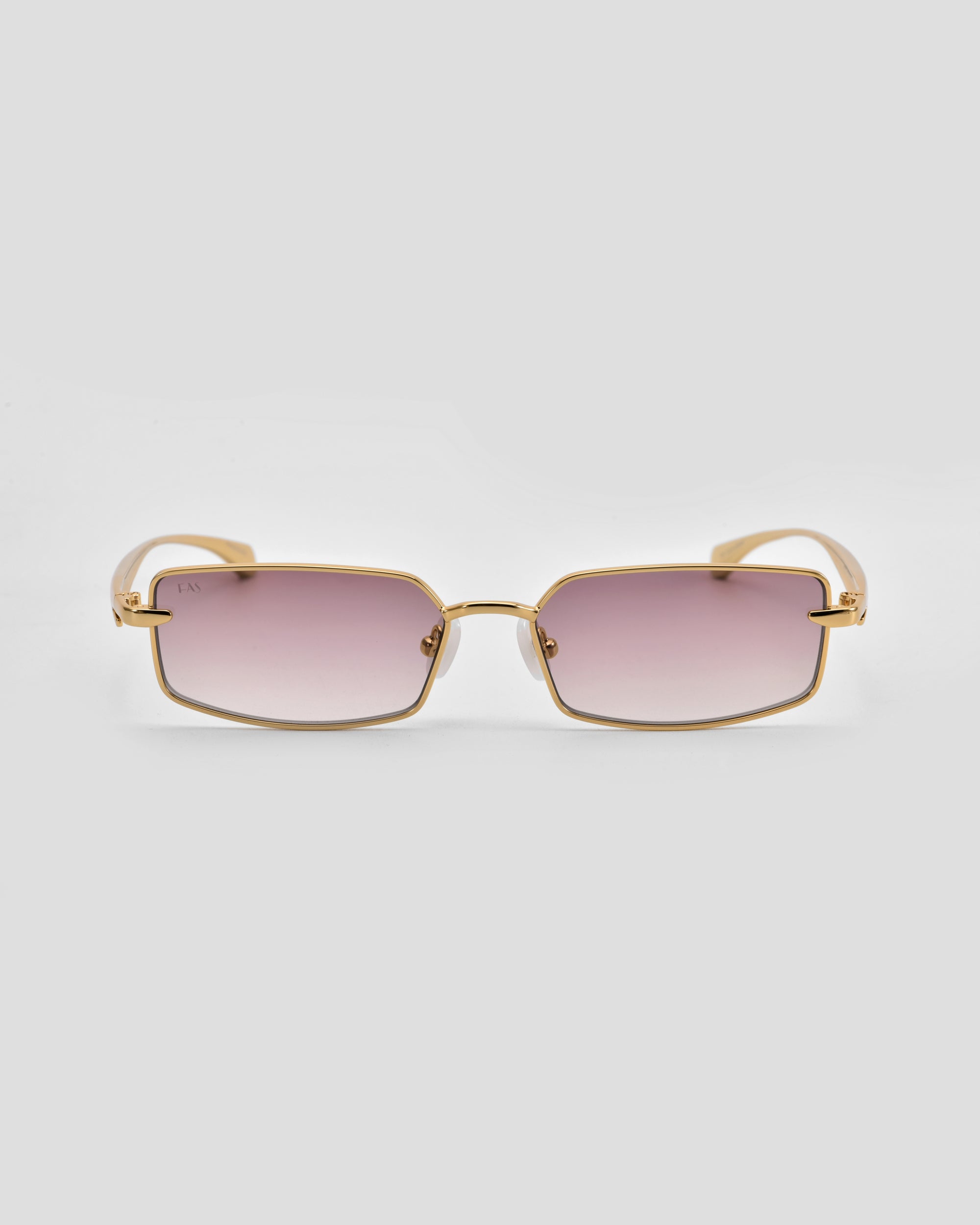 For Art's Sake® Lucio: rectangular gold-framed sculpted eyewear with pink gradient lenses, shown on a plain light gray background.