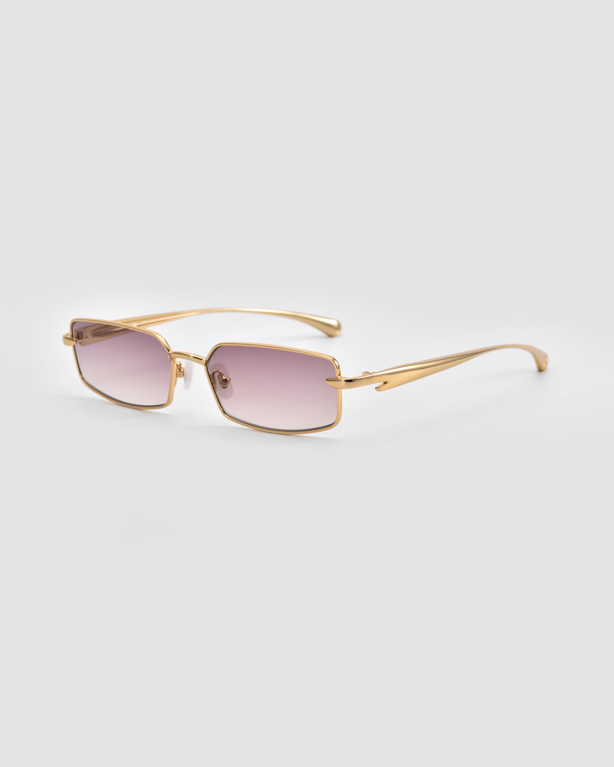 For Art's Sake® Lucio: Gold-framed sunglasses with rectangular, lightly tinted purple lenses and a subtle 3D swoosh temple, shown on a light gray background.