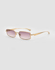 For Art's Sake® Lucio: Gold-framed sunglasses with rectangular, lightly tinted purple lenses and a subtle 3D swoosh temple, shown on a light gray background.