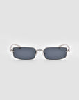 For Art's Sake® Lucio sunglasses feature rectangular sculpted dark-tinted lenses and slim metallic silver frames, shown against a plain light gray background.