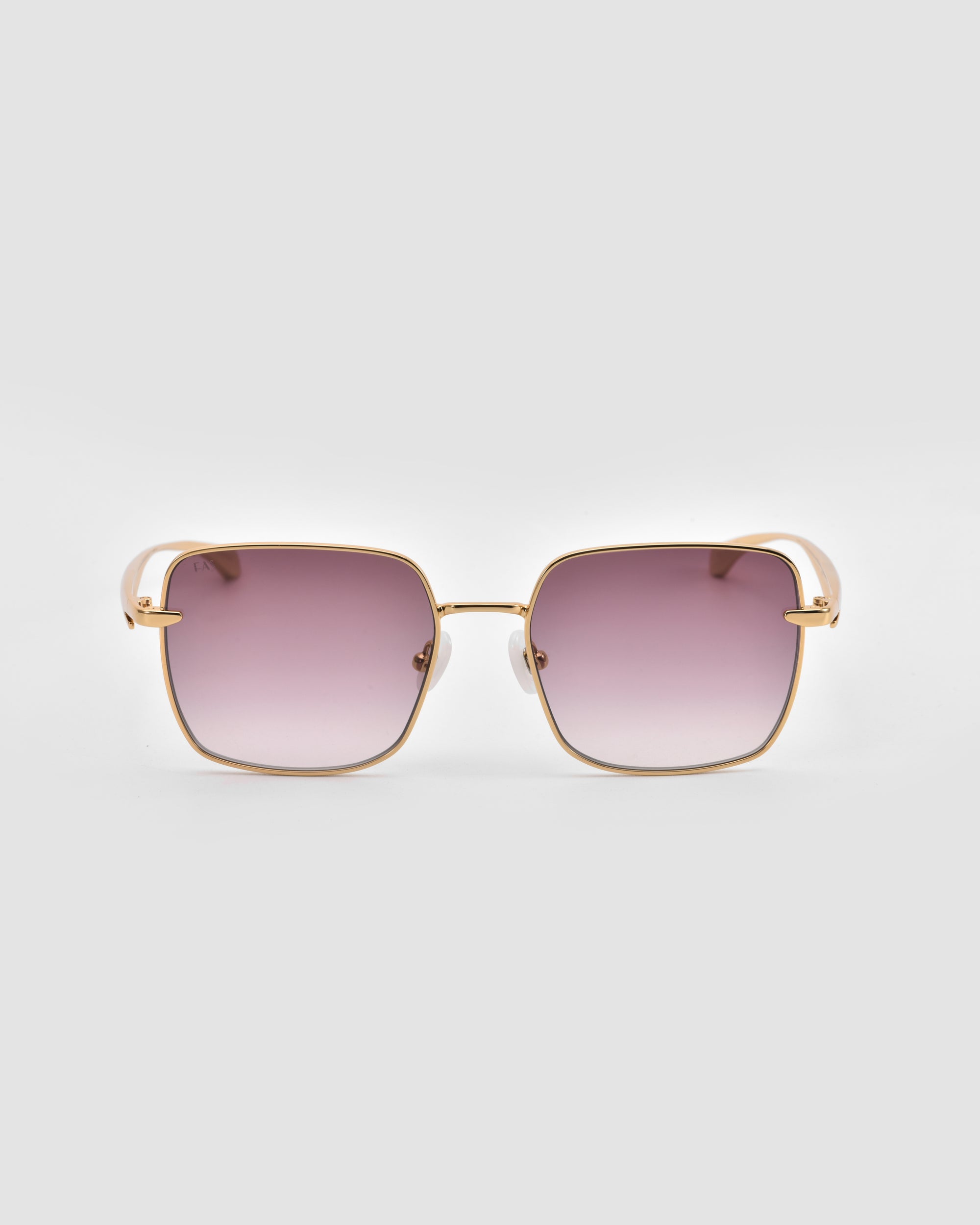 For Art's Sake® Edge sunglasses feature a square shape with gold metal frames and pink gradient lenses in a sleek rectangular silhouette, shown on a light grey background.